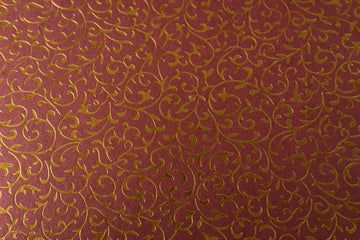 PAPEL ARTESANAL EMBOSADO DISEÑO ROJO FOLLAJE DORADO 22X29PULG
